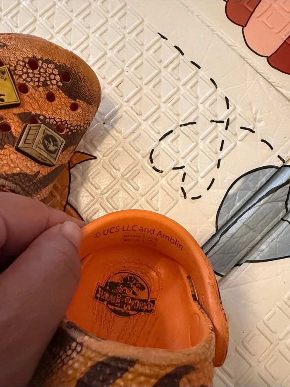 CROCS Kids Orange Patterned Clogs with Character Charms